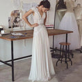 Robes de mariée bohèmes 2026 Robes de mariée style bohème avec manches courtes Col en V Dos nu Jupe plissée Robe trapèze élégante Personnalisable