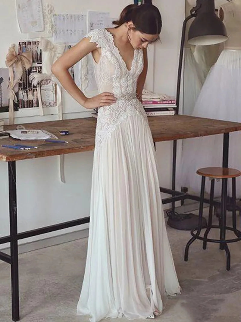 Robes de mariée bohèmes 2026 Robes de mariée style bohème avec manches courtes Col en V Dos nu Jupe plissée Robe trapèze élégante Personnalisable