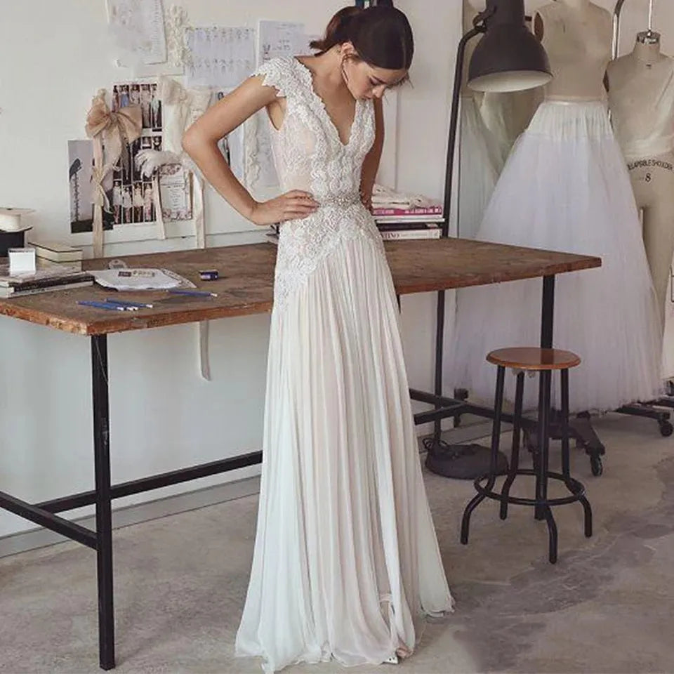 Robes de mariée bohèmes 2026 Robes de mariée style bohème avec manches courtes Col en V Dos nu Jupe plissée Robe trapèze élégante Personnalisable