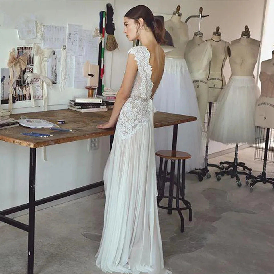 Robes de mariée bohèmes 2026 Robes de mariée style bohème avec manches courtes Col en V Dos nu Jupe plissée Robe trapèze élégante Personnalisable