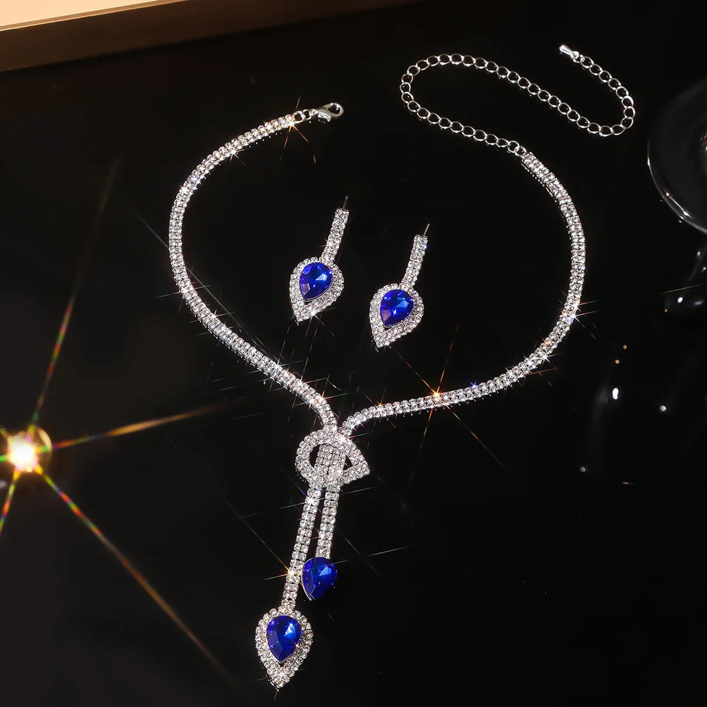 Parure collier et boucles d'oreilles goutte d'eau en cristal bleu saphir