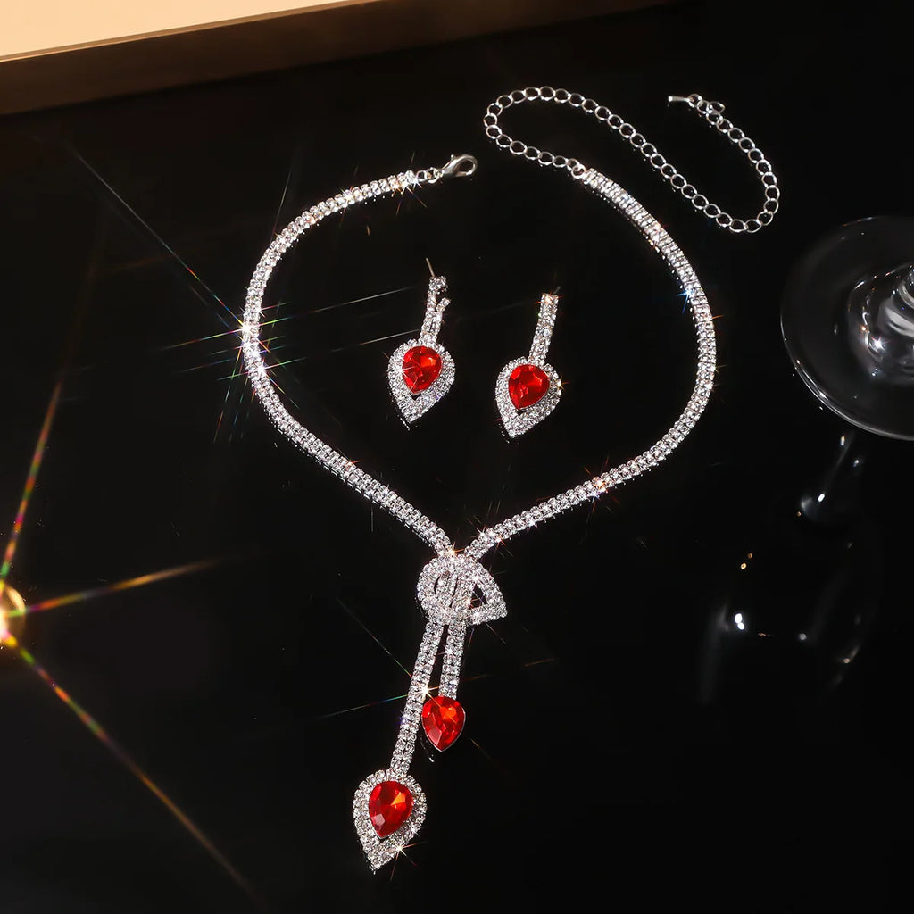 Parure collier et boucles d'oreilles goutte d'eau en cristal bleu saphir